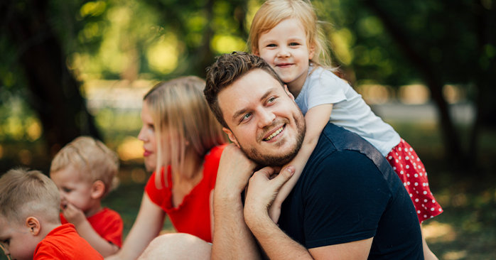 Man with his family in a park